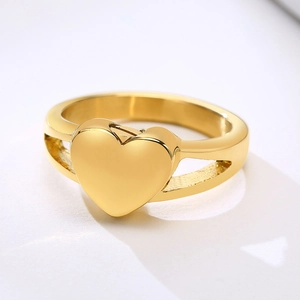 Macro shot of golden heart urn ring with a functional side opening for ashes