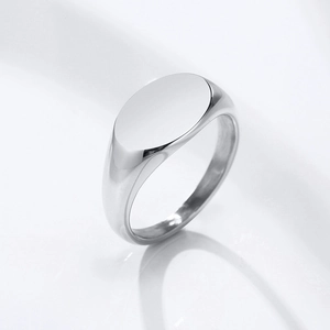 Detailed side view of polished stainless steel oval signet ring with smooth mirror finish