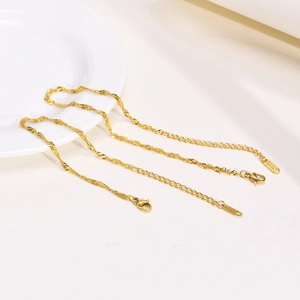 Golden stainless steel water wave chain bracelet with adjustable lobster clasp closure
