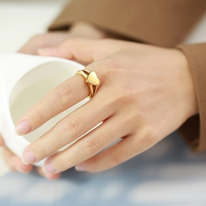 Minimalist gold heart-shaped cremation ring for women featuring a dual-band polished design