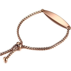 Adjustable rose gold slider bracelet featuring a polished curved bar for custom engraving