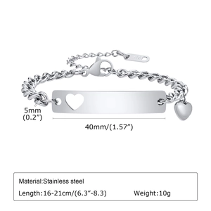 Macro detail of stainless steel ID bracelet with hollow heart and K18 engraving