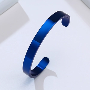 Detail shot of navy blue stainless steel open bangle with a polished minimalist finish