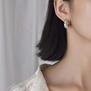 Minimalist silver C-shaped hoop earrings for women with high polished mirror finish surface