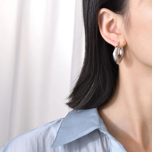Minimalist silver-toned U-shaped hollow hoop earrings featuring a polished finish for women