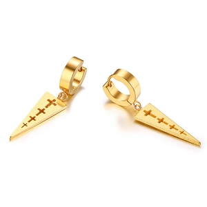 Detailed macro shot of golden stainless steel huggie earrings with hollow cross patterns