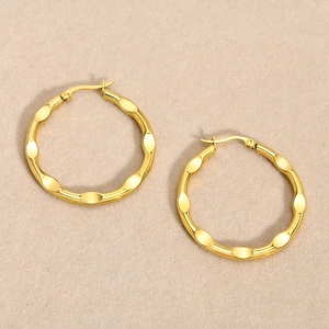 Fashionable gold stainless steel hoop earrings with hammered textured finish