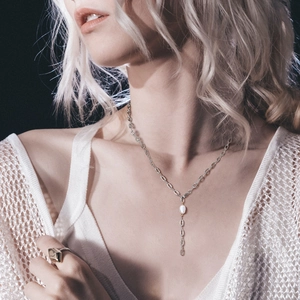 Detail view of Y-shaped stainless steel necklace with water-drop freshwater pearl pendant