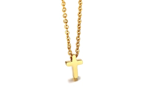 Macro shot of polished gold-plated stainless steel cross pendant on classic O-ring chain