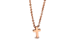 Detailed view of a rose gold minimalist cross pendant with a polished mirror finish