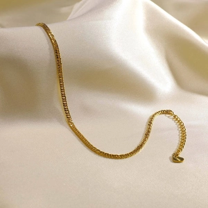 Detail of gold double-layer stainless steel anklet with S.Steel engraved heart charm