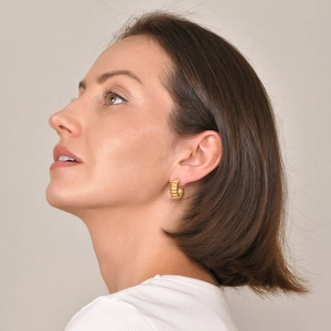 Modern gold ribbed C-shaped hoop earrings for women made of durable stainless steel