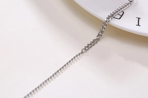 Detailed view of silver stainless steel mixed link chain with ball and curb segments