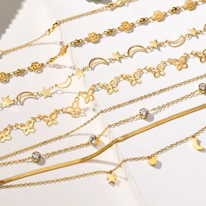 Collection of golden layered stainless steel anklets featuring butterfly and star moon charms