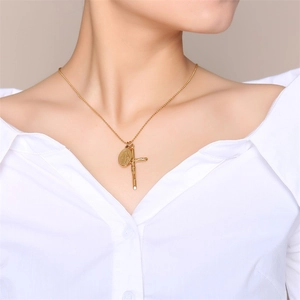 Golden necklace with crucifix and Virgin Mary medal pendants shown on a model