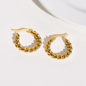 Minimalist golden twisted rope hoop earrings with high polish stainless steel texture