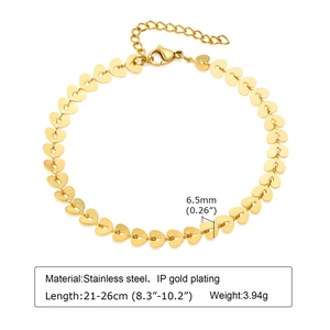 Macro view of gold stainless steel heart-shaped anklet with detailed product dimensions