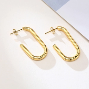 Minimalist gold geometric rectangular U-shaped earrings with a polished metal finish