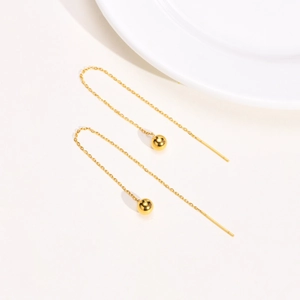 Detailed view of minimalist gold plated stainless steel long chain drop earrings with bead