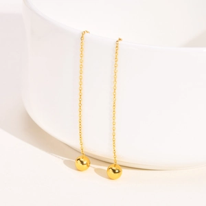 Elegant gold stainless steel drop threader earrings with polished beads on white cup
