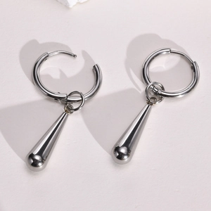 Detailed view of silver polished stainless steel water drop earrings on white background