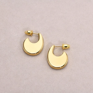 Polished gold U-shaped chunky crescent hoop earrings for women in minimalist style