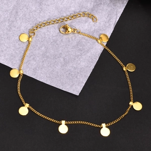 Detail of a gold titanium steel anklet featuring eight solid circular charms and lobster clasp
