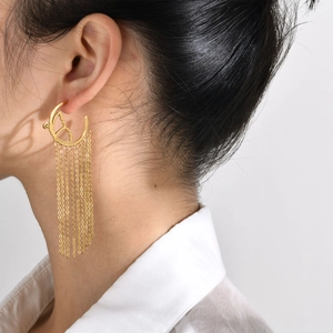 Golden stainless steel tassel earrings featuring butterfly accent and long metal chains