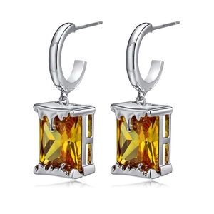 Minimalist silver earrings with yellow rectangular zircon and artistic molten texture detail