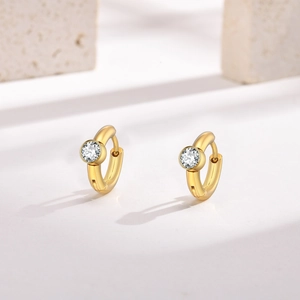 Detailed view of 18K gold plated C-shaped hoop earrings with sparkling bezel-set zircon