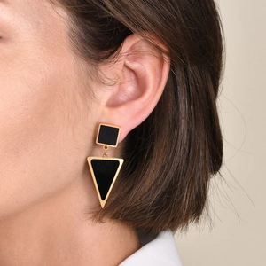 Modern minimalist gold triangle geometric earrings for women on model ear
