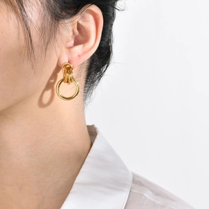 Polished gold multi-hoop interlocking earrings featuring a layered architectural design