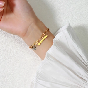 Golden double-layer stainless steel bracelet featuring a Good Luck engraved metal tag