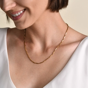 Elegant 18k gold plated stainless steel thin link chain necklace worn by a model