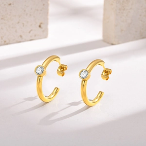 Detailed side view of 18K gold plated C-shaped earrings with round cubic zirconia studs