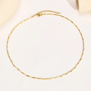 Detailed view of polished 18k gold plated stainless steel necklace with lobster clasp