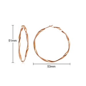 Detail view showing 51mm by 53mm twisted rose gold stainless steel hoop earrings