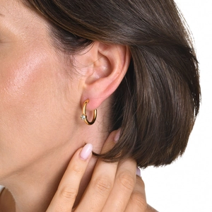 Close-up of 18K gold plated stainless steel C-shape hoop earring with zircon on ear