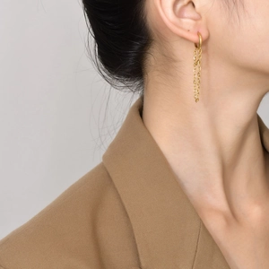 Elegant gold stainless steel long chain hoop earrings on model for a minimalist look