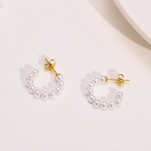 Elegant gold-plated C-shaped stainless steel hoop earrings with white faux pearls for women