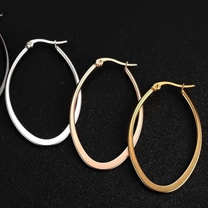 Polished stainless steel oval hoop earrings in gold, silver, and rose gold finishes