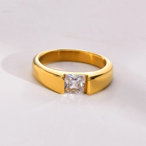 Macro view of wide gold plated titanium steel ring with a square clear zircon inlay