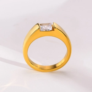 Macro view of gold-plated stainless steel ring with square green zircon setting