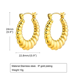 Detailed view of U-shaped gold earrings showing 24mm size and stainless steel texture