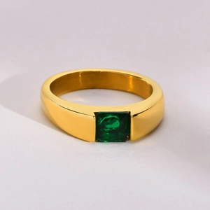 Macro shot of 18k gold plated titanium ring featuring a square-cut green zircon stone