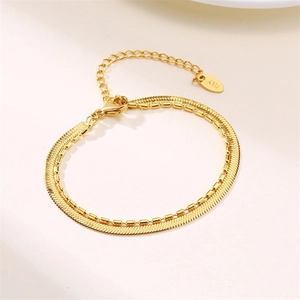 Elegant gold double layer snake and bead chain bracelet with lobster clasp and K18 tag