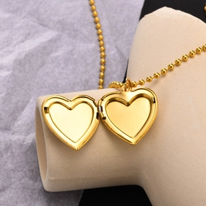 Golden heart locket necklace in stainless steel with ball chain and open compartment