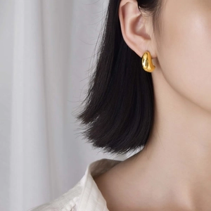 Polished gold drop earrings for women with minimalist geometric teardrop design