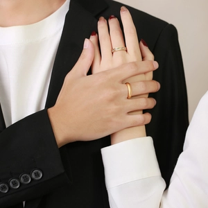 Classic gold titanium steel couple rings set with cubic zirconia stones on female band