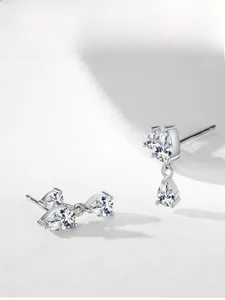 Detail of 925 silver pear-cut zirconia drop earrings with elegant tassel design